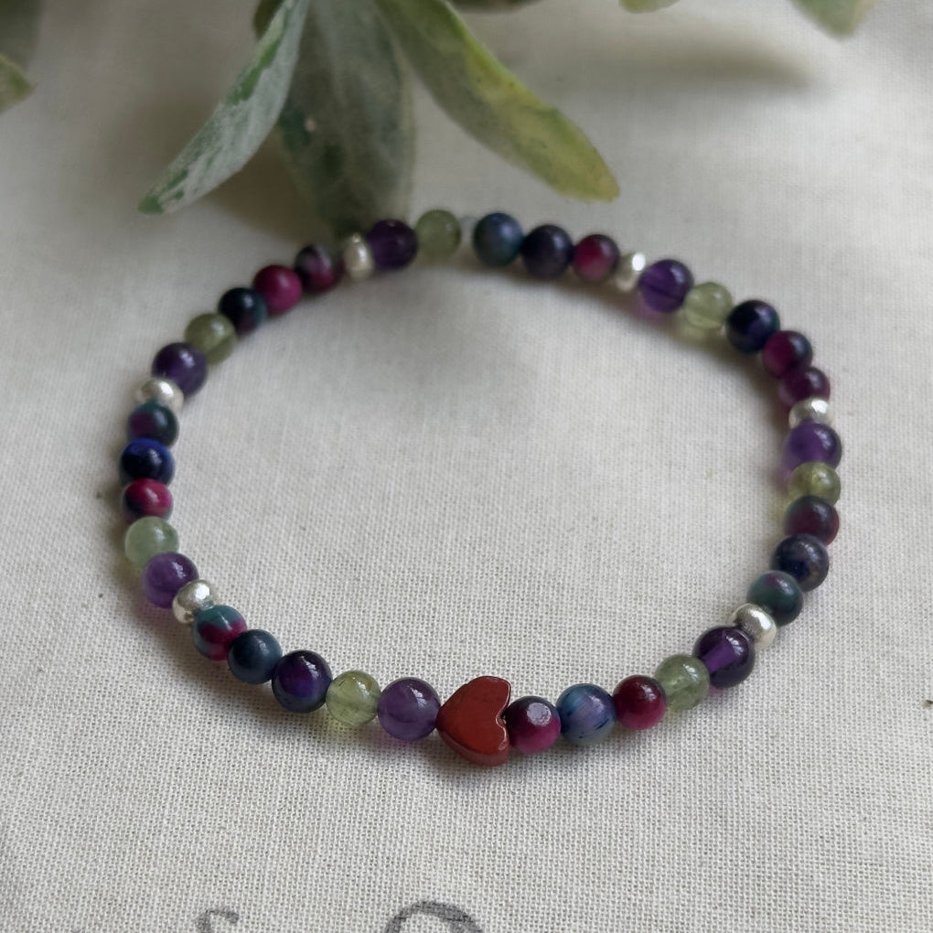 Courage and motivation gemstone bracelet featuring Red Jasper, Peacock Tiger’s Eye, Green Apatite and Amethyst for women