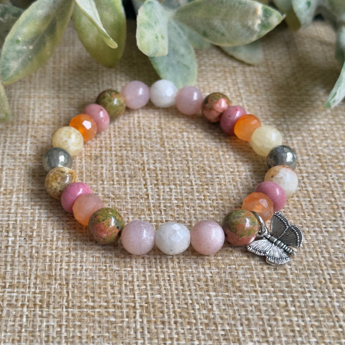 Handcrafted motherhood journey crystal jewelry worn as a supportive new mom bracelet gift.
