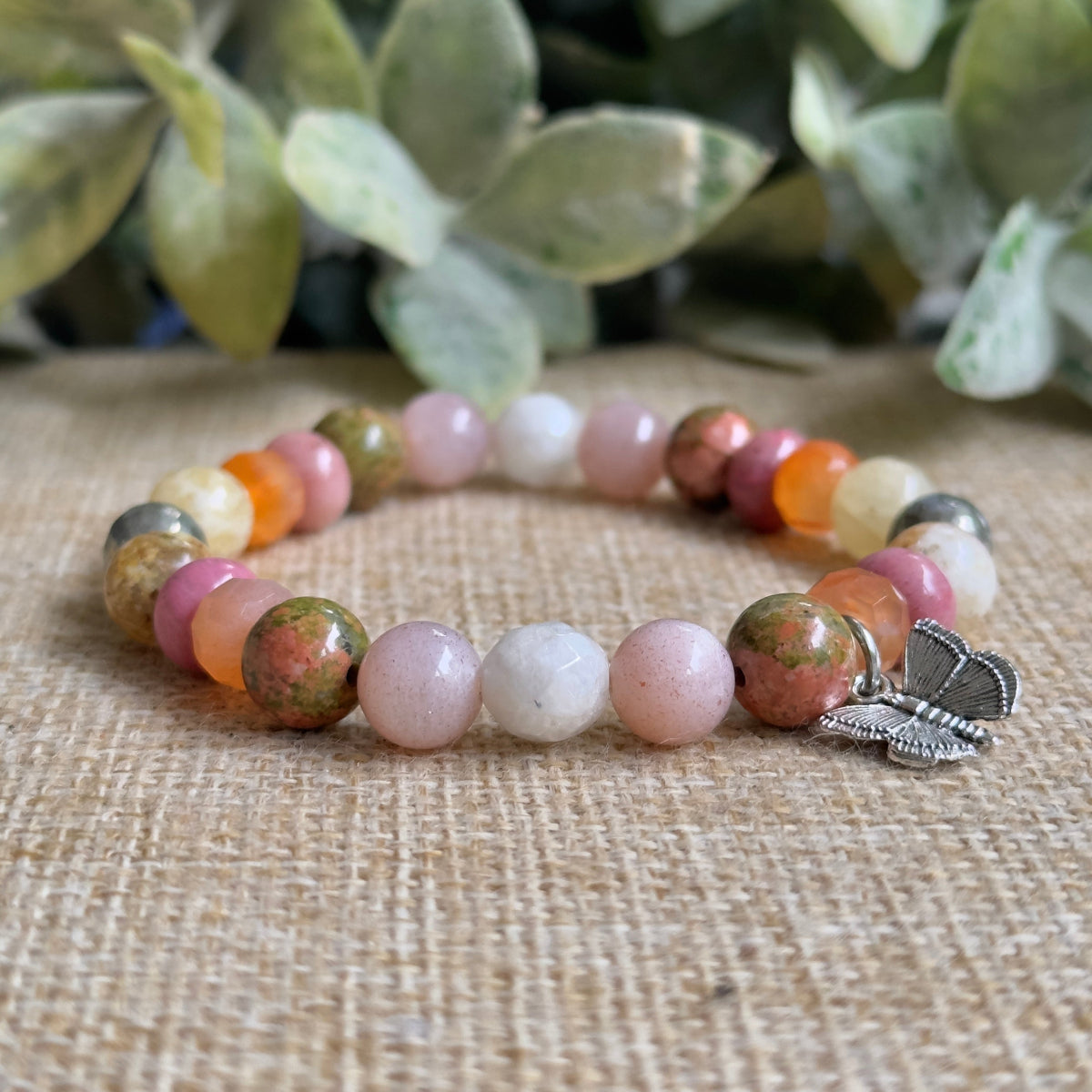 Conception to Cradle gemstone bracelet for fertility pregnancy and childbirth with silver butterfly charm.