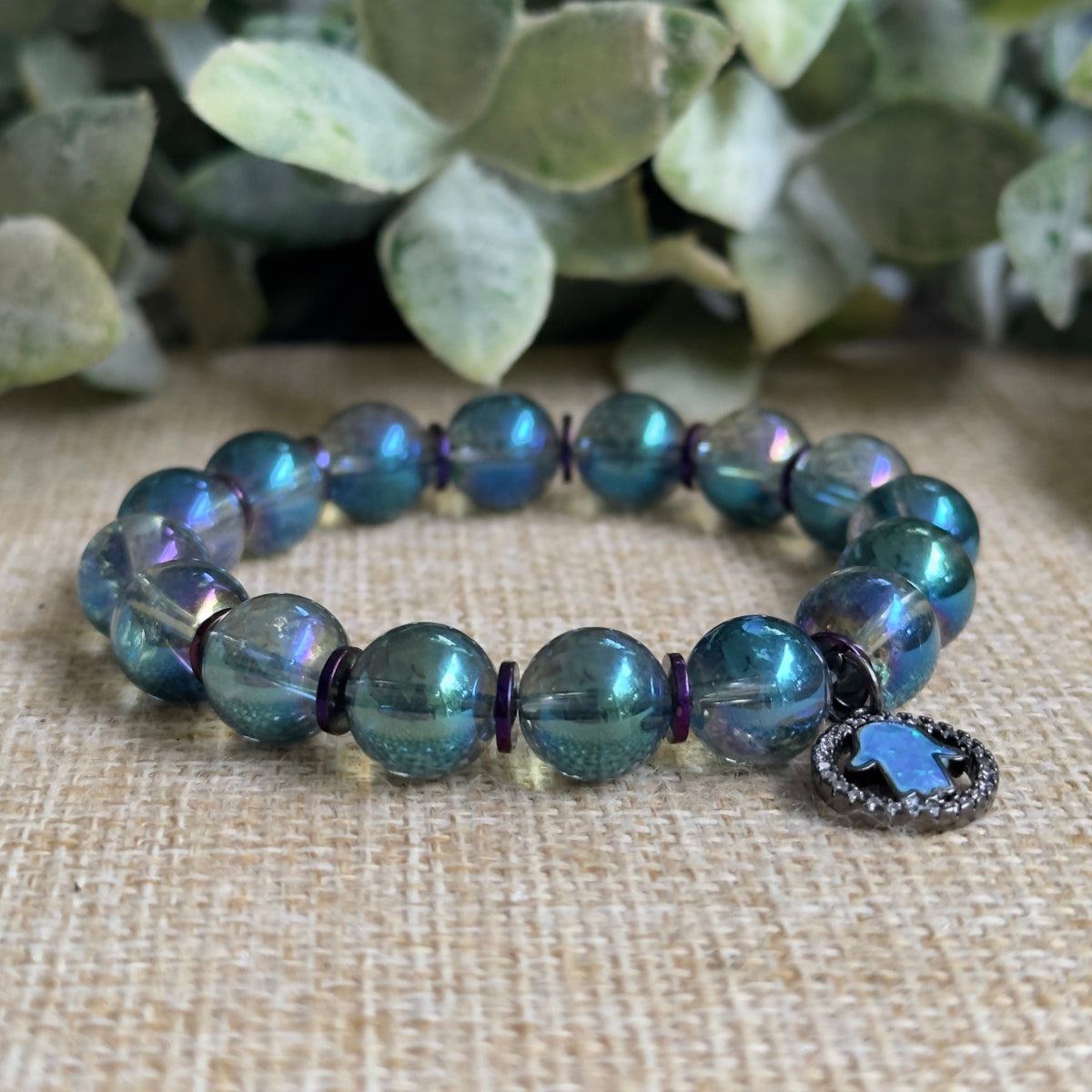 Witching Hour bracelet featuring iridescent greenish blue aura quartz and purple hematite