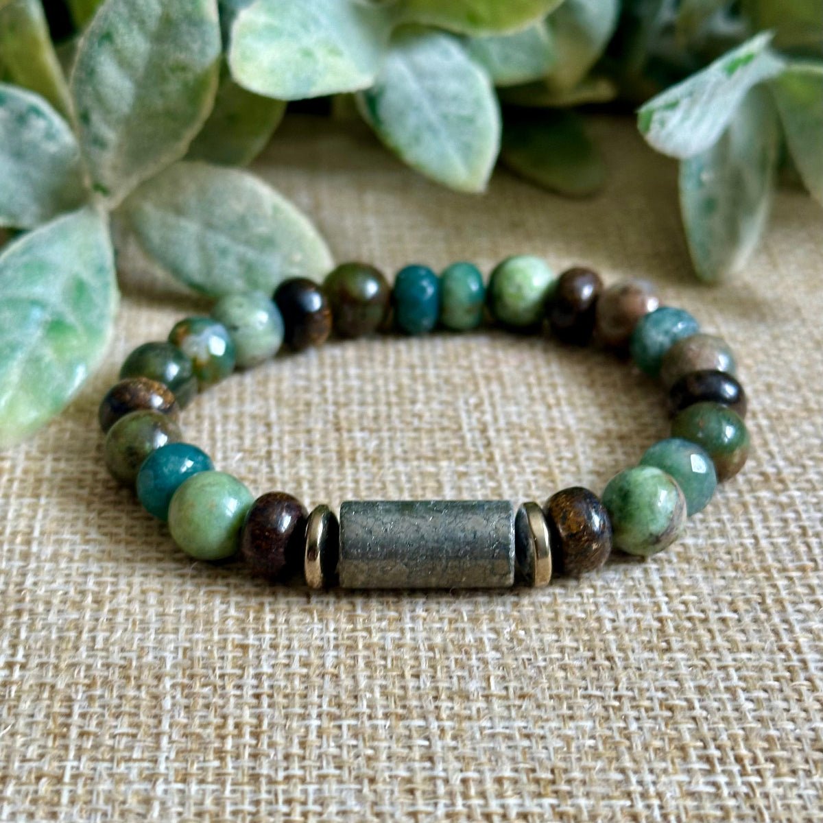 Moss agate and pyrite abundance bracelet with earthy green and gold tones
Grounding gemstone bracelet for prosperity featuring green opal, bronzite and gold hematite