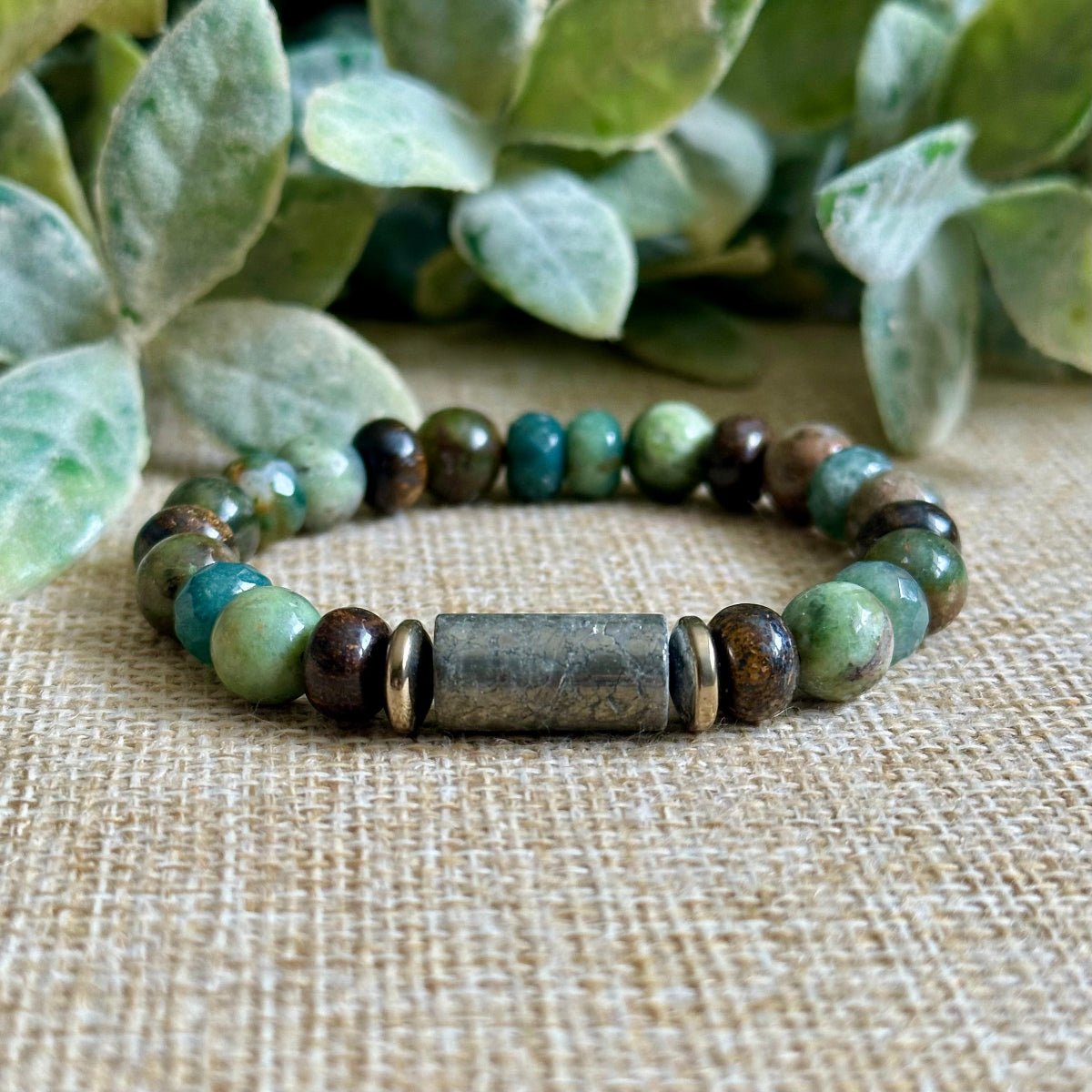 Abundance and Growth crystal bracelet with pyrite tube, gold hematite, bronzite, green opal and moss agate beads