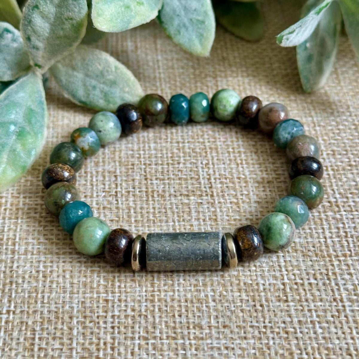 Handmade abundance bracelet with natural moss agate and pyrite focal tube
Crystal bracelet for growth and prosperity with green and gold gemstone beads