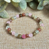 Close-up of Attracting Love Mini Bracelet showing heart-shaped Rhodonite and soft pink Rose Quartz beads symbolizing compassion, forgiveness, and the opening of the heart to new love.