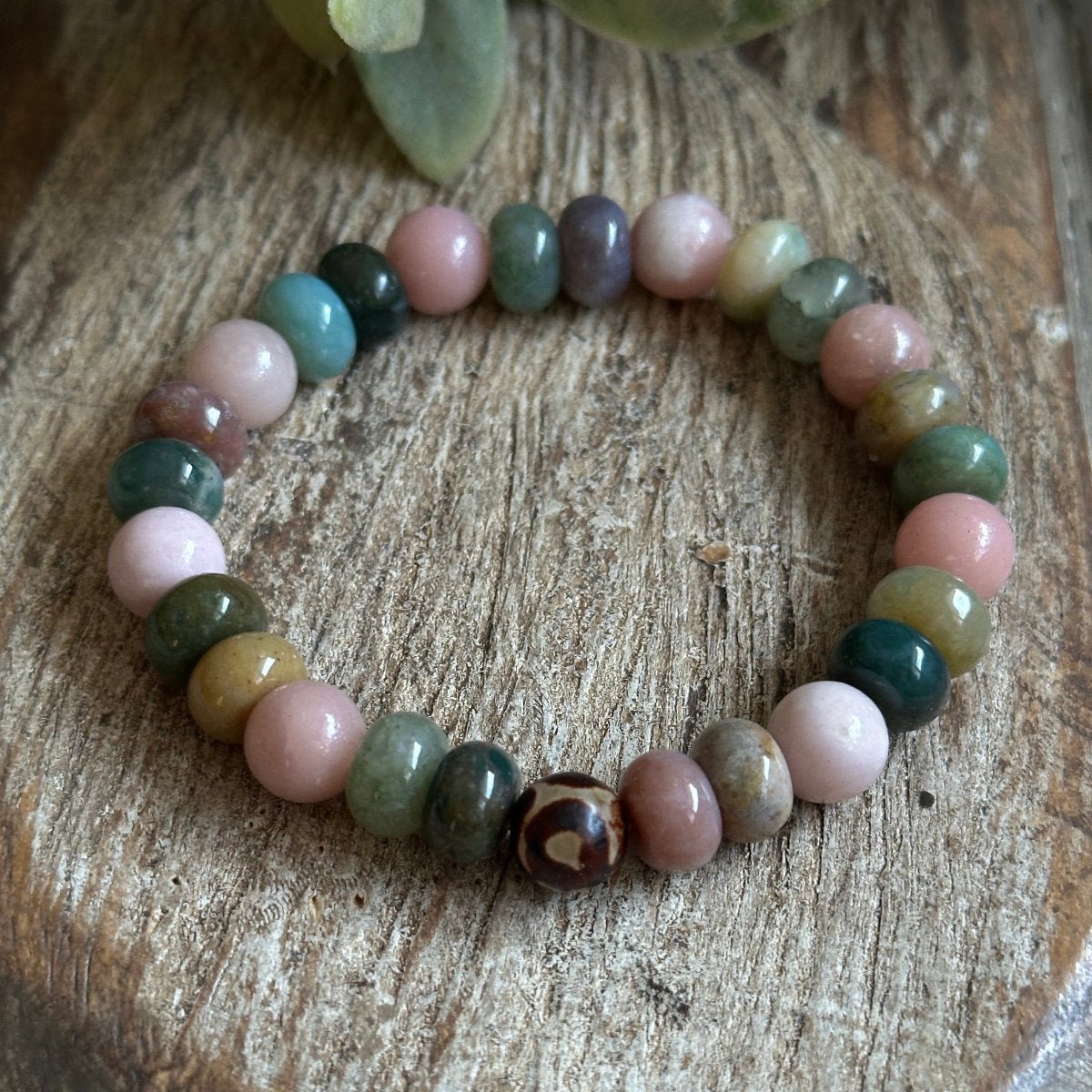 Close up of theHeart & Hearth bracelet featuring Indian Agate & Pink Opal stones. Symbolizees love, grounding and warmth