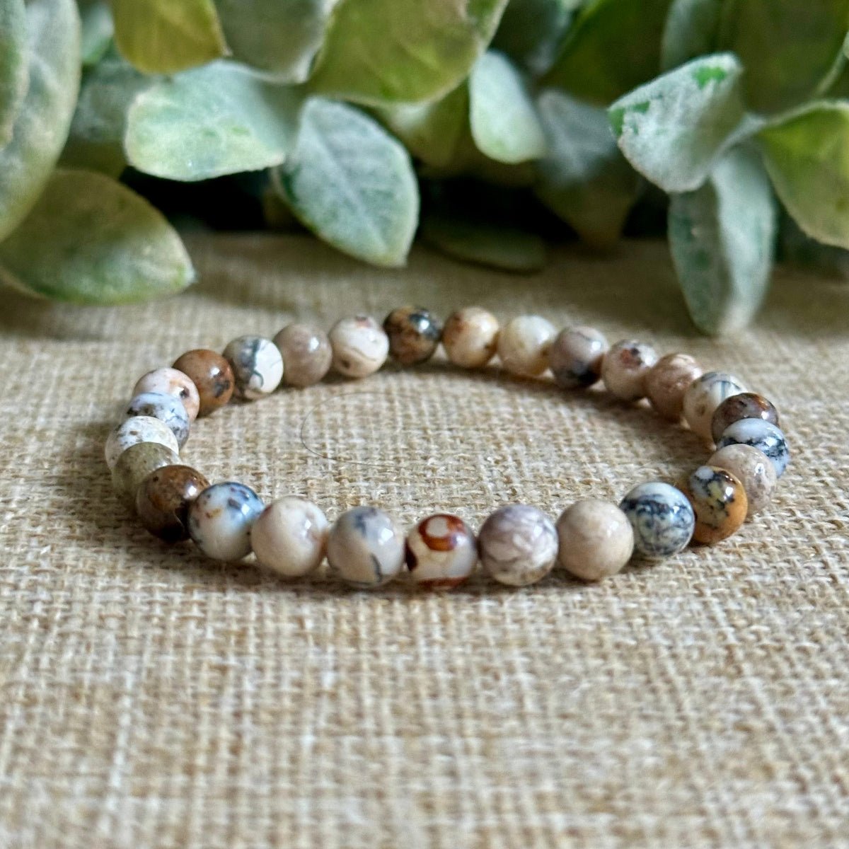 Dendritic opal gemstone bracelet for personal growth and transformation
Natural dendritic opal crystal bracelet with optional DZI evil eye agate