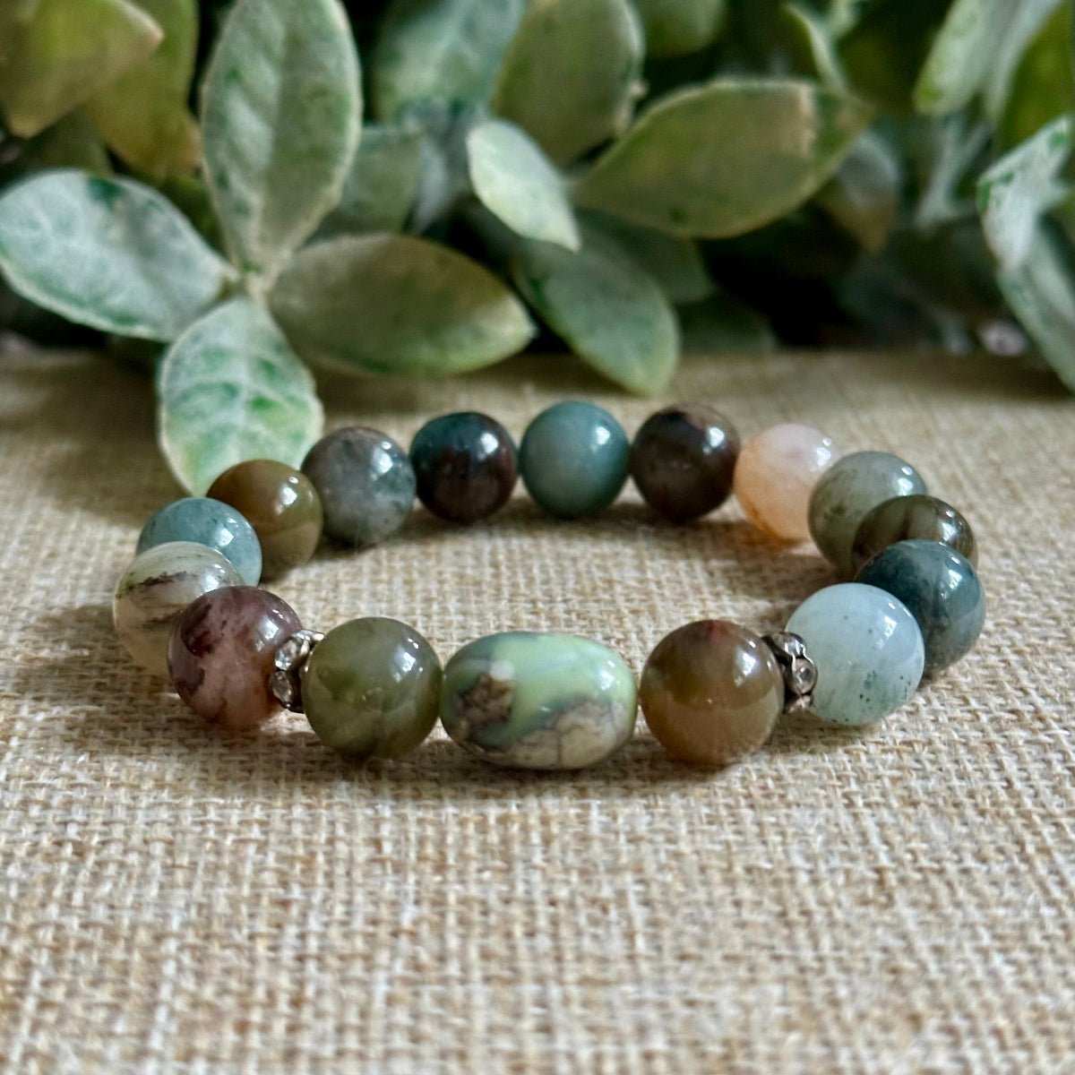 A meaningful Phantom Quartz and Dragon Skin Agate bracelet designed to inspire growth, transformation, resilience, confidence, and new beginnings. Handmade with natural 10mm gemstones.