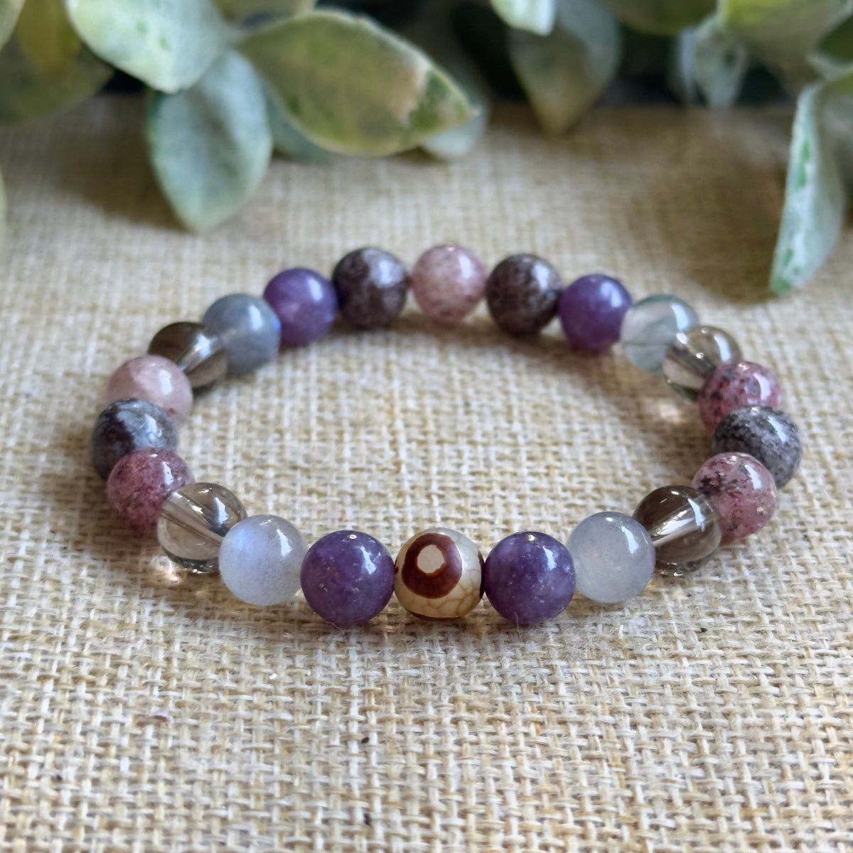 Beaded gemstone bracelet for empath aura protection and emotional boundary setting worn on a wrist.