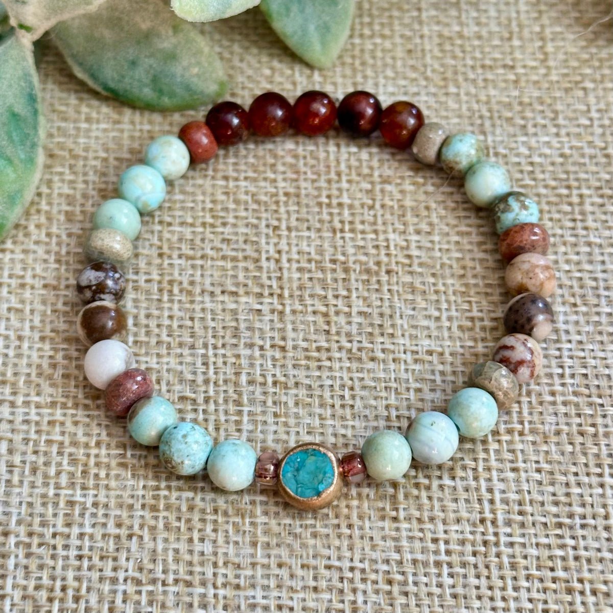 Grounding gemstone bracelet for positivity, balance, and good energy

Earthy beaded gemstone bracelet with copper turquoise centerpiece