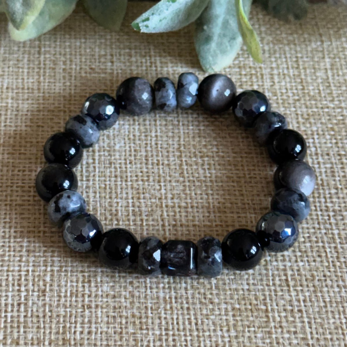 Protective night energy bracelet with subtle sheen and grounding tones