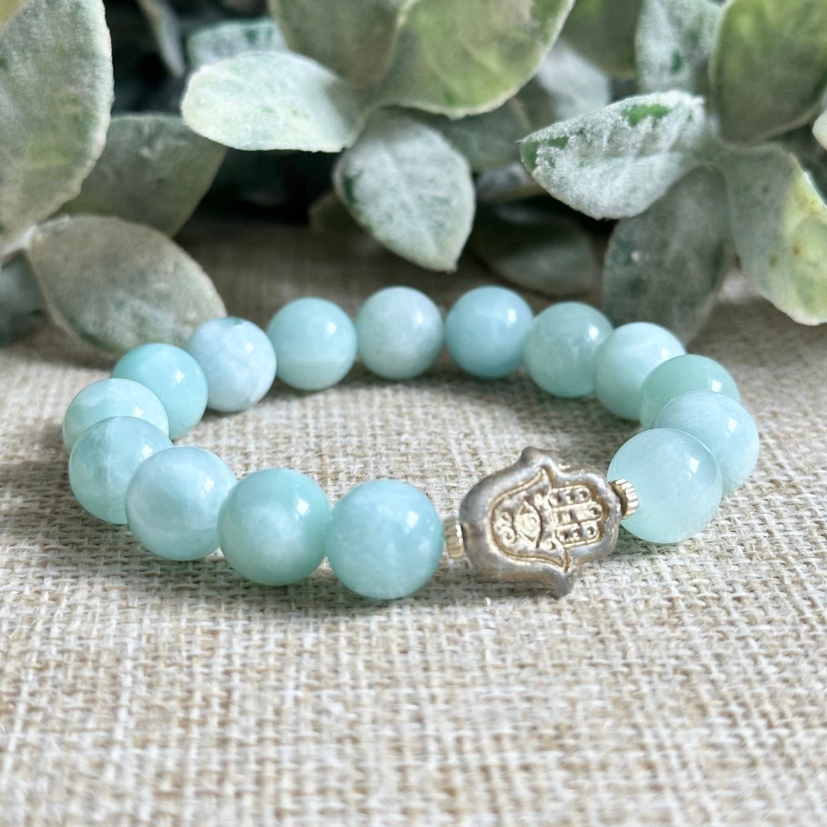 jadeite bracelet 10mm beads with matte hamsa charm
green jadeite gemstone bracelet for abundance and wealth