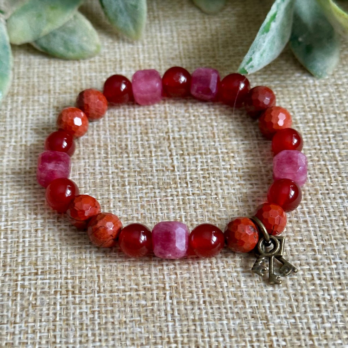 bold red and pink beaded bracelet for confidence and empowerment, gemstone bracelet with optional three key charm symbol