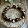 Handmade gemstone bracelet for grounding, protection, balance and optimism.