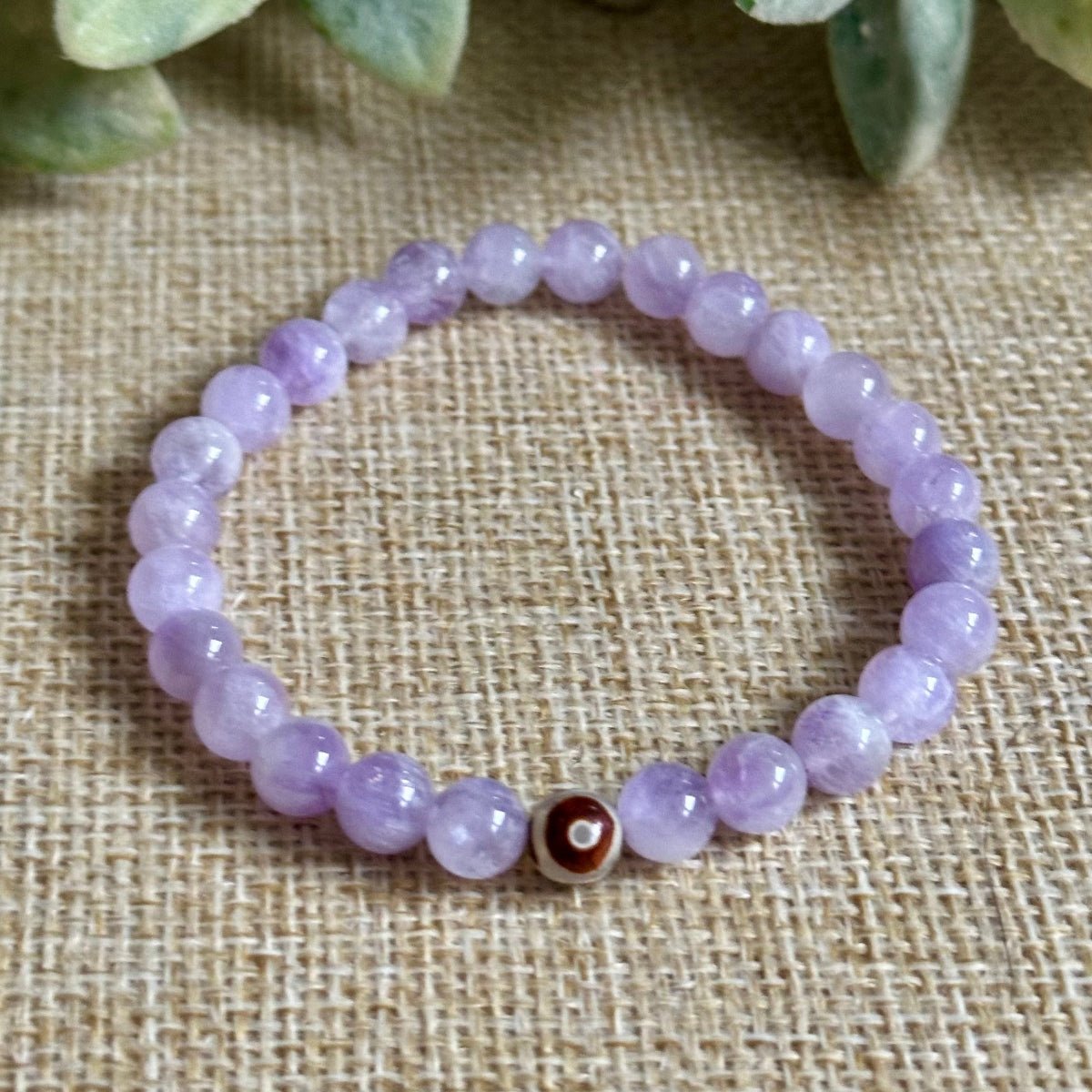 Purple gemstone bracelet for peace clarity and spiritual protection
Lavender Amethyst beaded bracelet with evil eye protection option