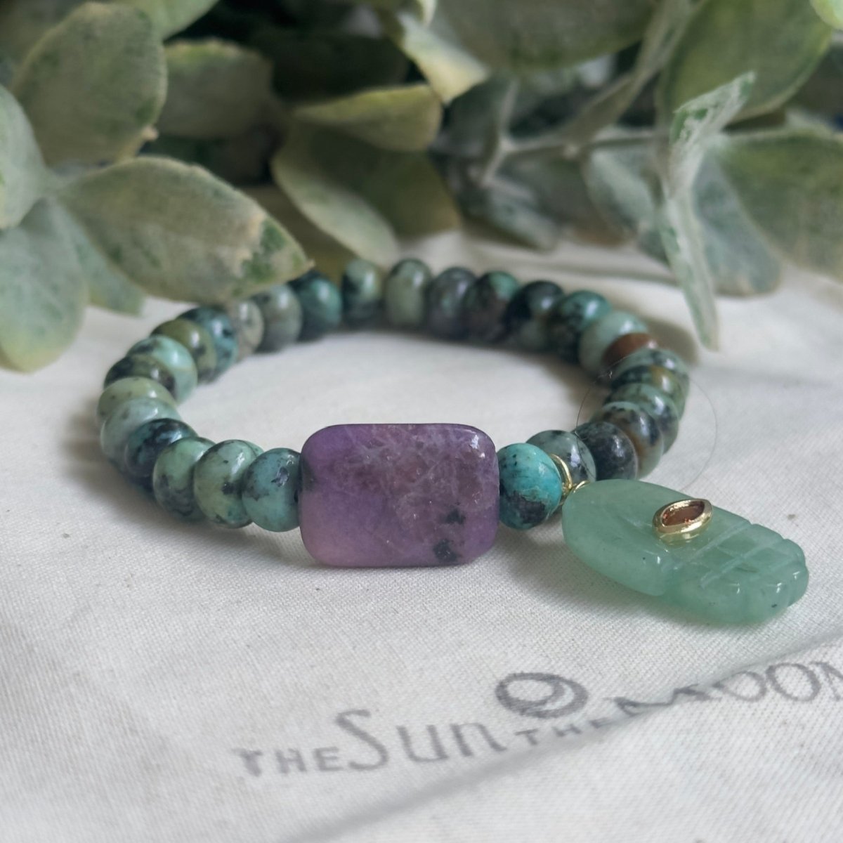 Handmade gemstone bracelet featuring green aventurine, lepidolite, and african turquoise beads.