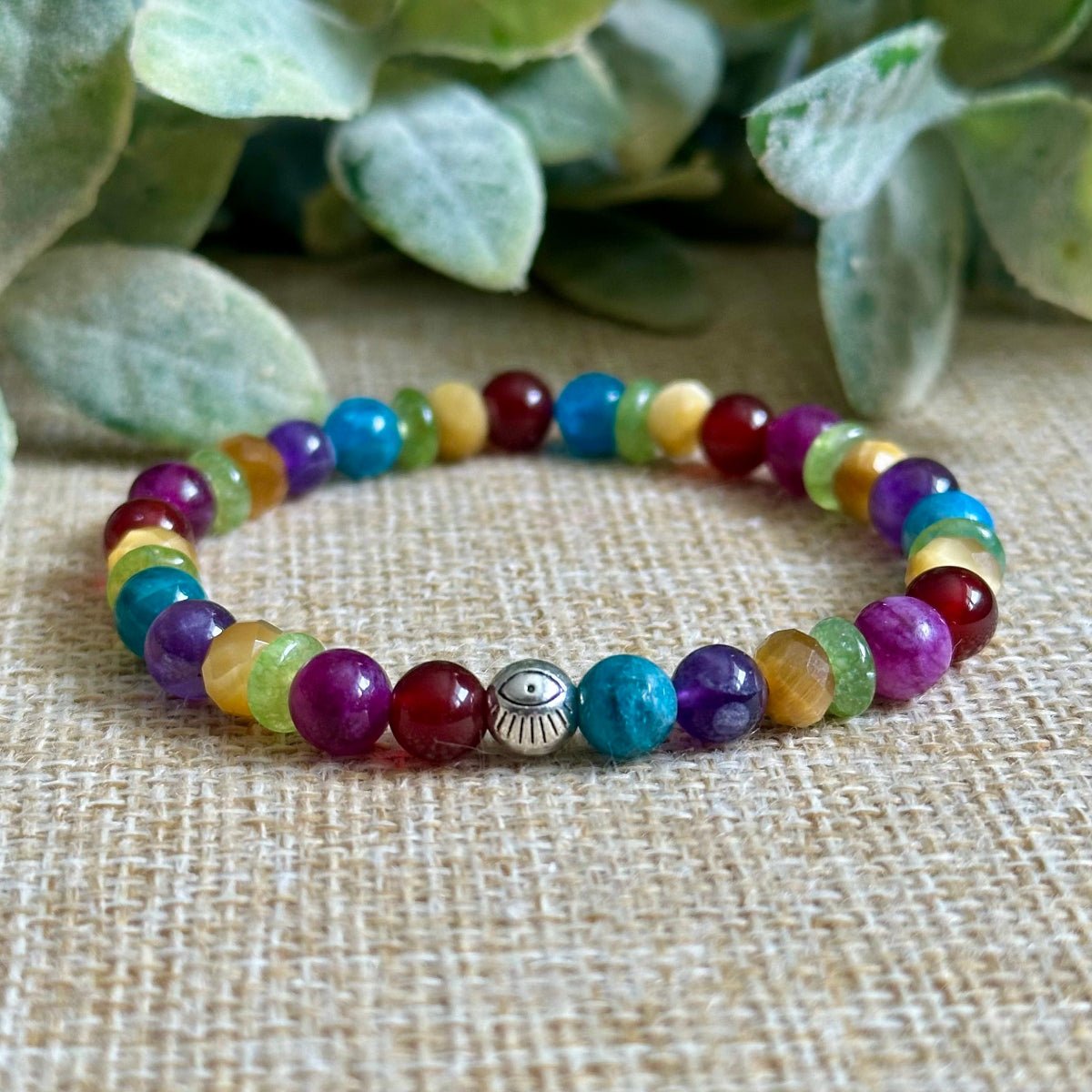 living color gemstone bracelet colorful 6mm beads red jade lepidolite peridot tiger eye apatite amethyst
colorful crystal bracelet with evil eye bead calm clarity confidence bracelet