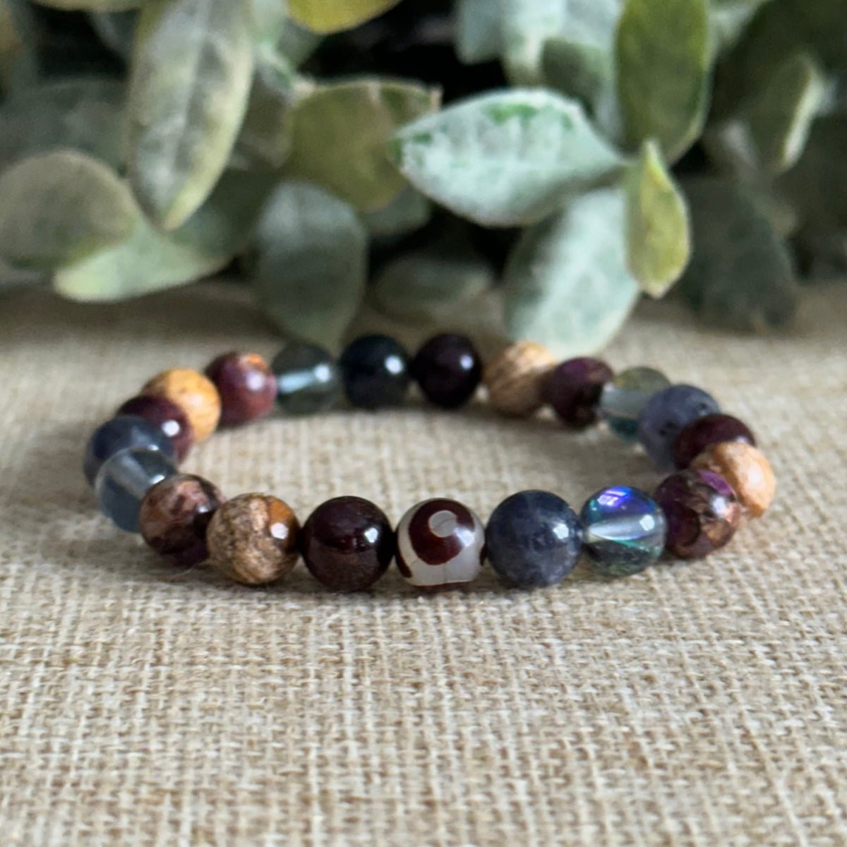 Positively Positive Energy crystal bracelet with picture jasper and garnet
Grounded positive energy gemstone bracelet with iolite and black aura quartz