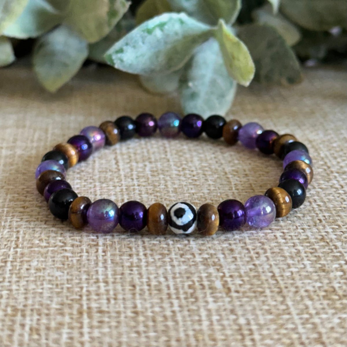 Handmade protection bracelet with purple gemstones for calm and energy shielding