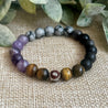 Grounding and Protective Bracelet featuring Snowflake Obsidian and Amethyst