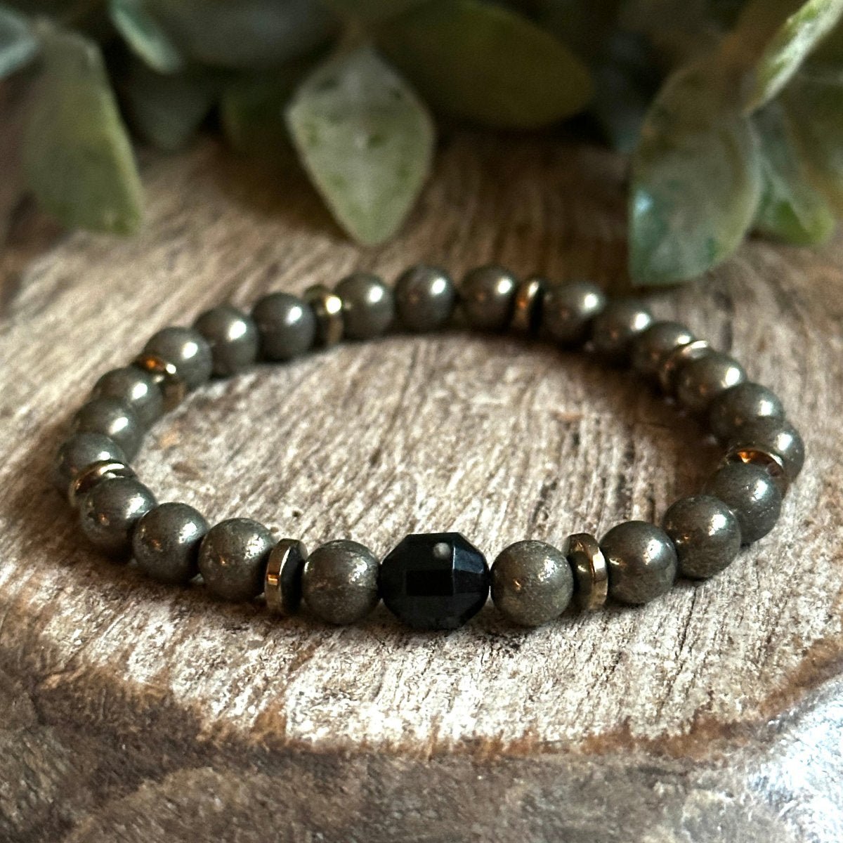 A handmade gemstone energy bracelet featuring Pyrite for Abundance, Hematite for  groundng and black tourmaline for protection.  Perfect for Empaths