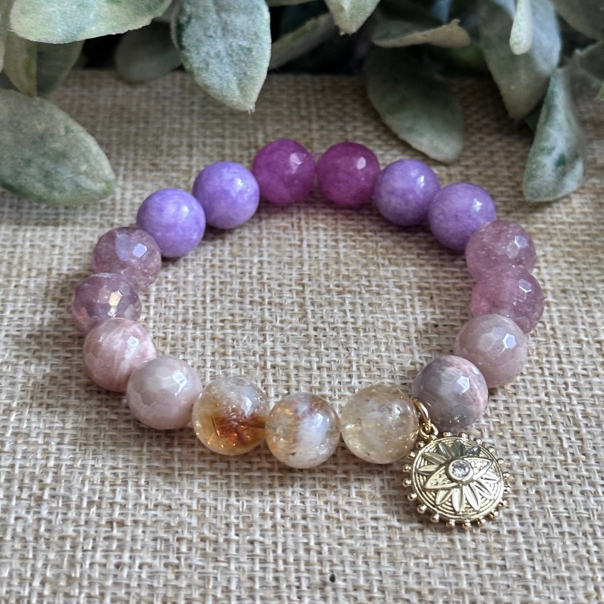 10mm gemstone bracelet with optional gold sun and evil eye charm for positive energy, protection, emotional balance, and radiant healing