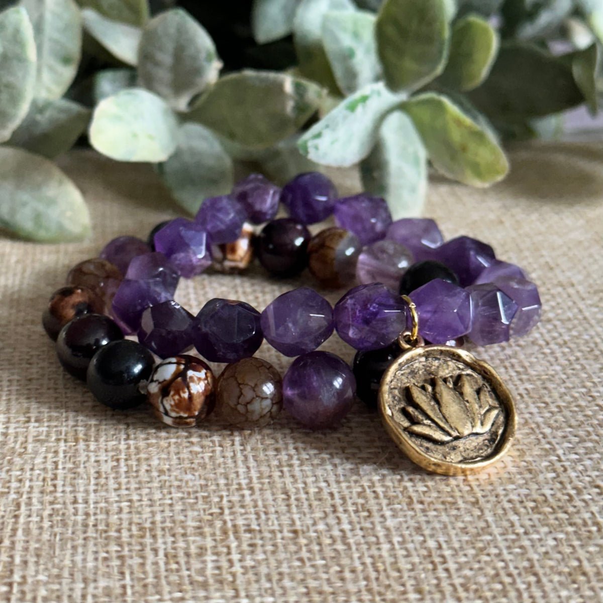 Purple amethyst crystal bracelet for calm awareness and growth
Spiritual amethyst lotus charm bracelet for inner peace and clarity