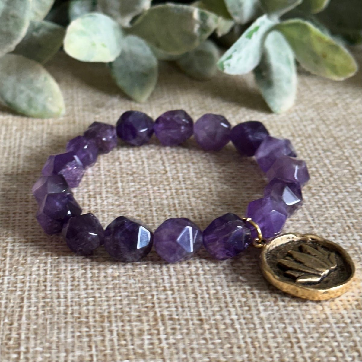 Handmade amethyst bracelet with antique gold lotus charm
