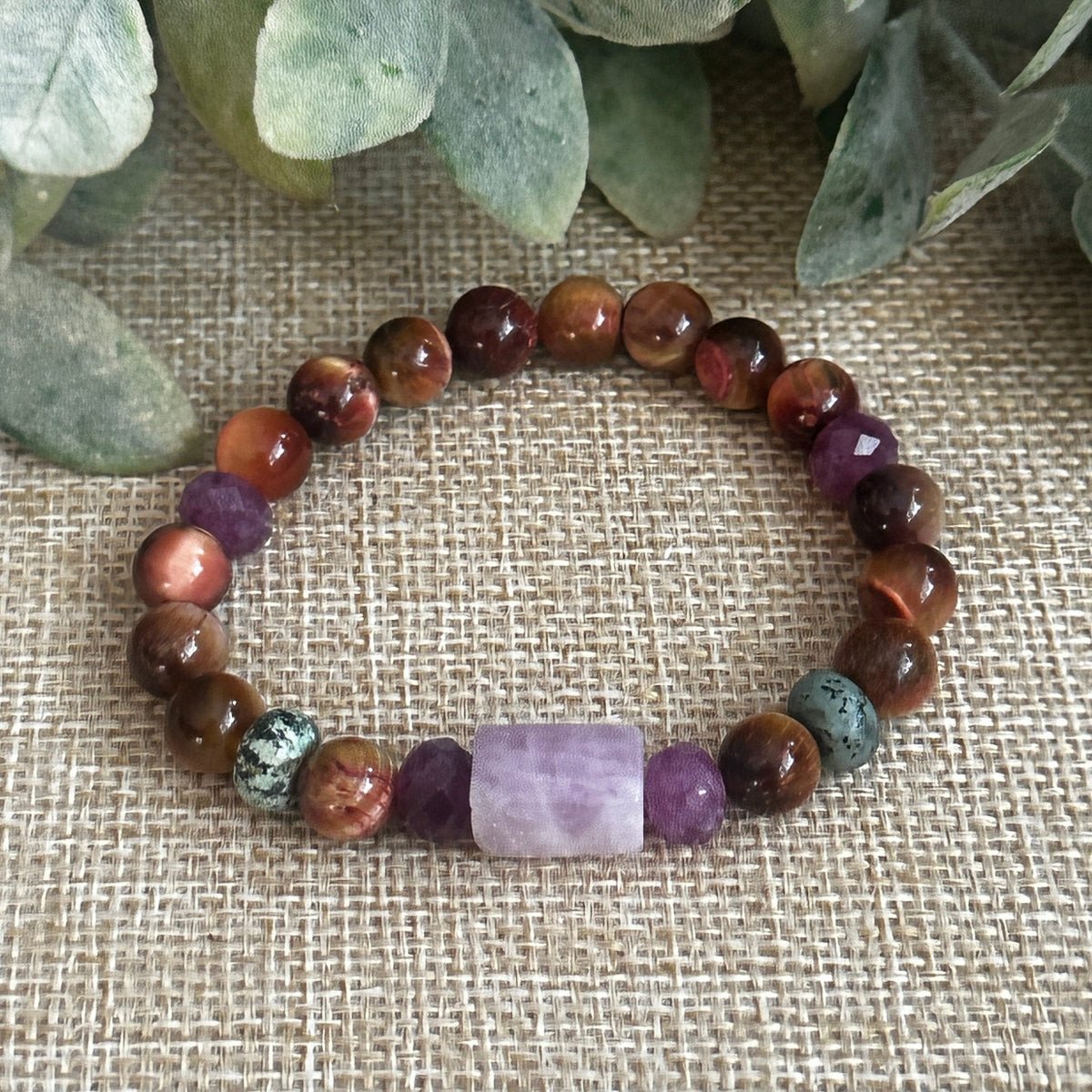 Gemstone jewelry balancing compassion, strength, and mischief