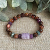 Gemstone jewelry balancing compassion, strength, and mischief