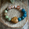 Gemstone bracelet iwth Picture Jasper Heart and 10mm beads of Apatite, Sakura Agate, and Green Opal. 